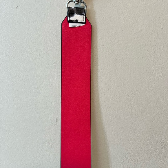 Purse straps. One is 42” long and leopard print, other faux patent leather 32”. - Picture 7 of 8